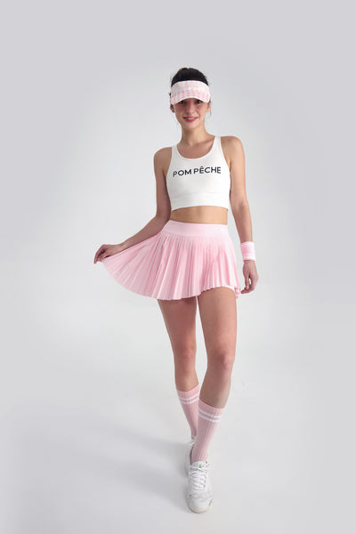 PAN プリーツ ミニ テニススカート ピンク - アシンメトリー・チャーム
